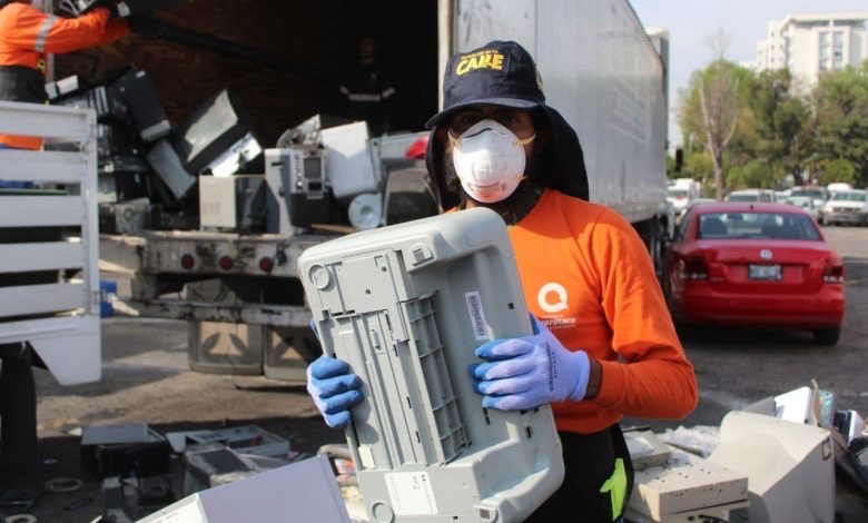 man holding a printer for recycling